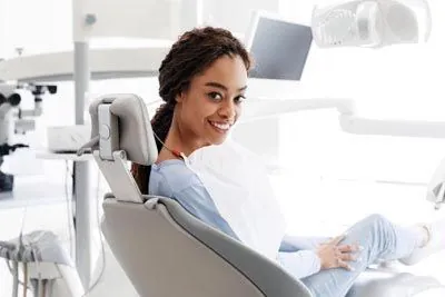 woman smiling during her restorative dentistry appointment at Gina Biedermann DDS