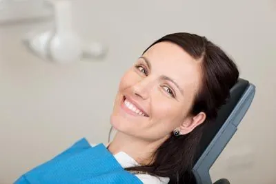 woman smiling during her laser dentistry appointment at Gina Biedermann DDS