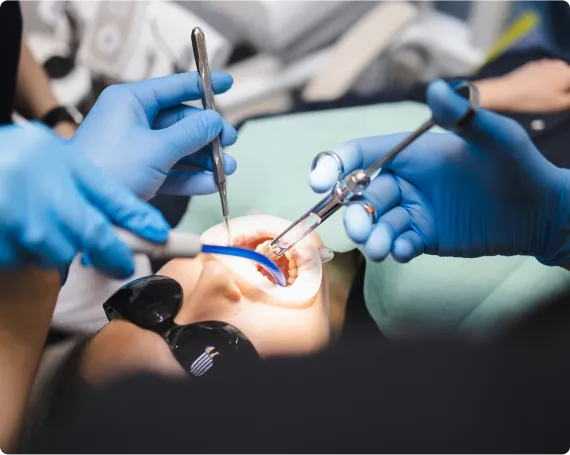 Dentist performing professional dental treatment on a female client