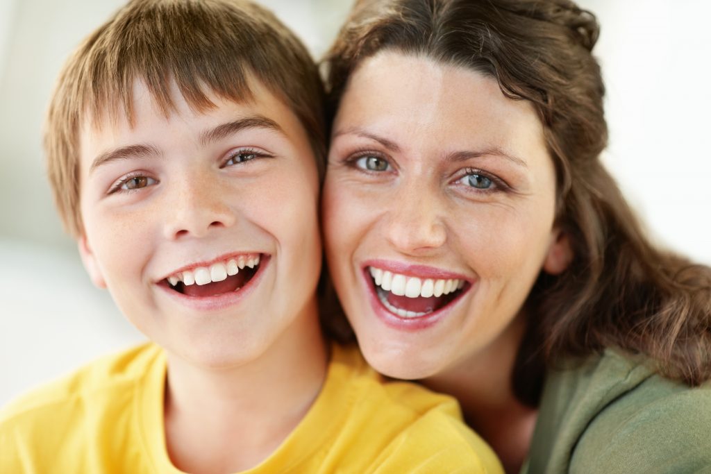 Mom and son share confident smiles