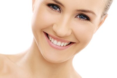 Headshot of smiling woman with bright white teeth. Positive and confident expression.